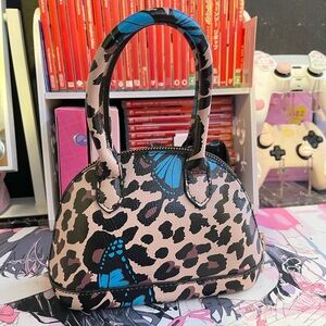 Leopard print handbag with blue butterflies